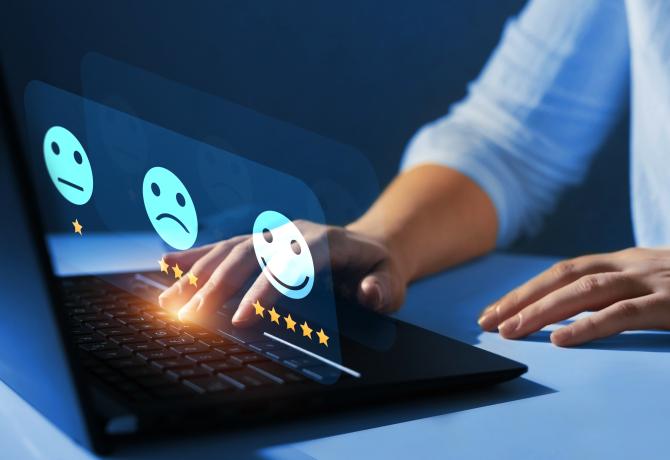 person completing a survey on a desktop computer